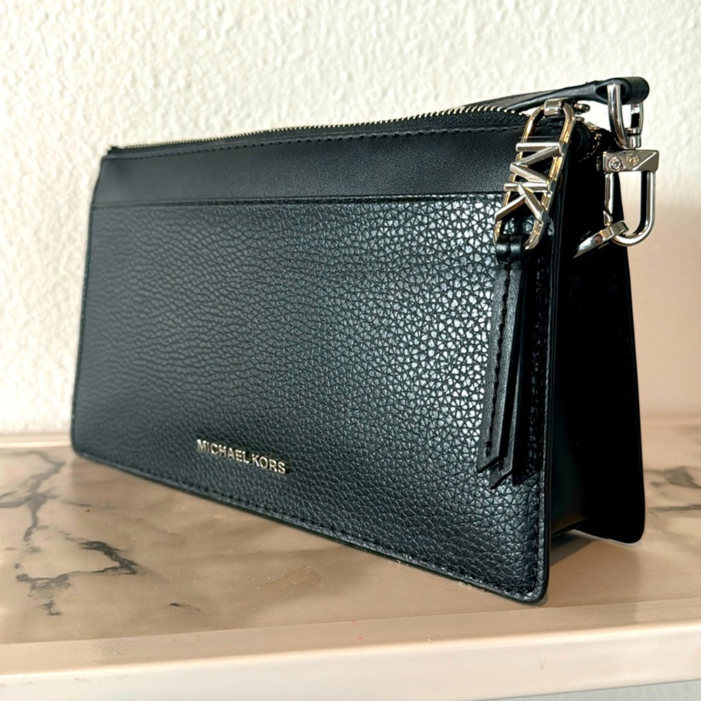 Black Michael Kors adjustable crossbody bag.